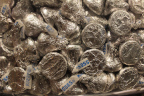 Photo of a close-up of a bunch of silver foil wrapped Hershey's Kisses
