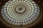 Photo of an ornate stained glass rotunda roof