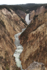Photo of the Yellowstone River with brown hills on either side